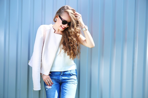 Young woman in sunglasses outside