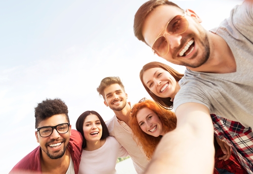 Looking up at a happy group of people